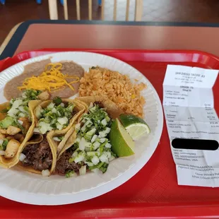 $12.49 for 3 tacos, rice and beans.