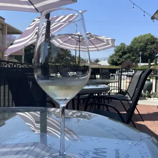 a glass of wine on a table