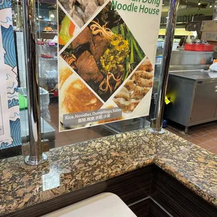 a restaurant counter with a menu on it