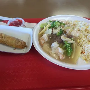 Three delight with white sauce and an egg roll.  10 bucks. Can't go wrong.