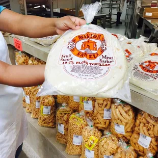 a person holding a bag of food