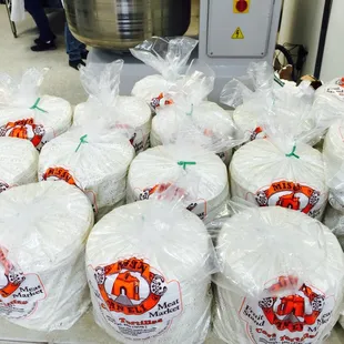 a large pile of wrapped cheese