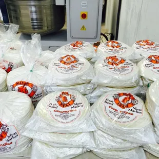 a large pile of wrapped tortillas