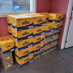 a stack of boxes and a broom