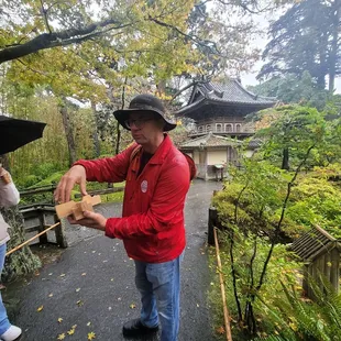 Tour guide Eric showcasing an example of Japanese joinery from his wood shop