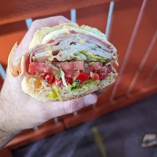 Turkey and Mortadella with cheese and all the works on Italian herb roll. Huge and delicious!