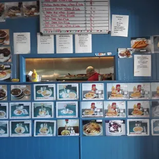 a blue refrigerator with pictures on it