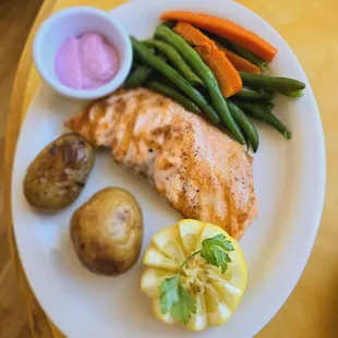 Salmon, veggies,  two potatoes,  and beet cream.