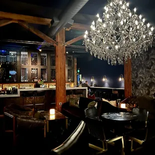 a bar with chandelier