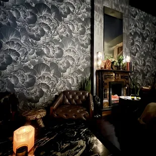 a living room with a couch and a fireplace