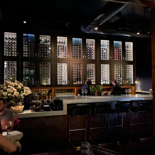 a woman sitting at a bar