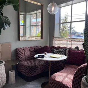 Semi-circular sofas in each of the windows