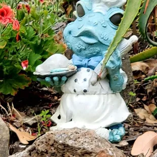 A cute little figurine of a chef frog! At the SF zoo.