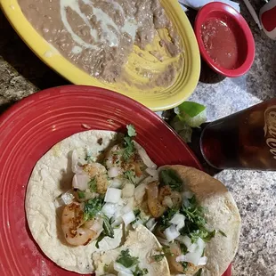 Shrimp tacos with beans and corn tortillas