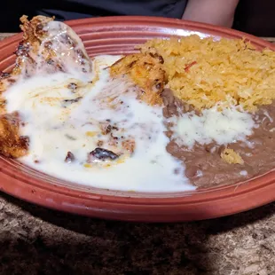 a plate of mexican food on a table