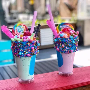 two milkshakes with sprinkles and candy
