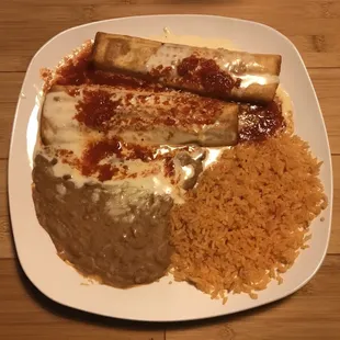 a plate of enchiladas and rice