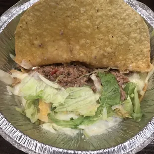 Beef (that did not taste like beef) tacos with a soggy shell.