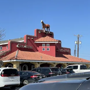 a horse on top of a restaurant