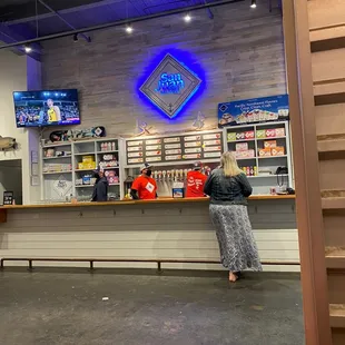 a woman standing at a counter