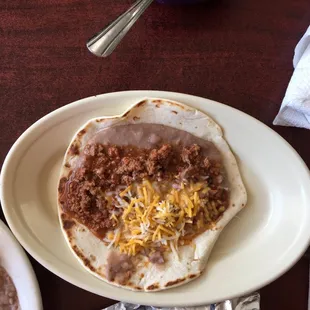 Meat beans, cheese taco