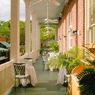 porch with tables and chairs