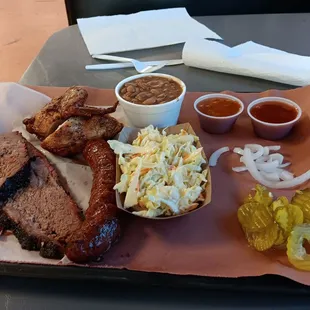 Notice heo small the chicken is.   But they're generous with the sides.  Both the coleslaw and pinto beans were very good.