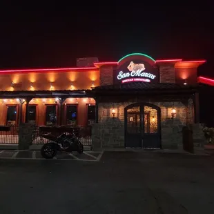 a motorcycle parked in front of the restaurant