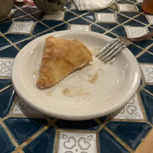 Sopaipilla. Topped with cinnamon sugar and honey.