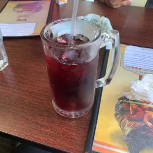 a drink in a glass on a table