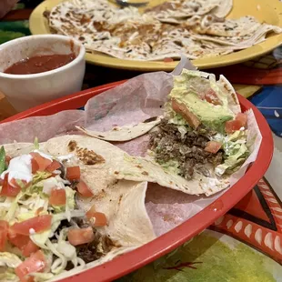 Carne asada tacos and beef Mexican pizza