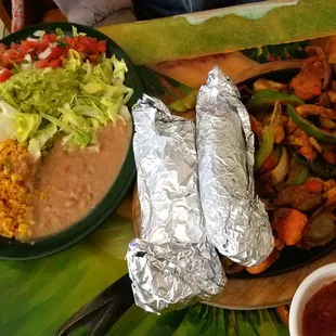 Fajitas - beef, chicken, and shrimp. Definitely enough for two people...