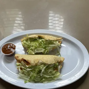 Homemade quesadillas , we have sautéed mushrooms or tinga ( shredded chicken breast grilled onion in a chipotle tomato sauce