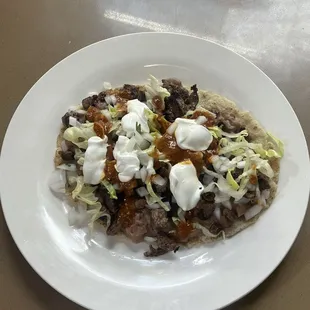 Huarache served with your choice of meat , al pastor , carne asada , chorizo or chicken