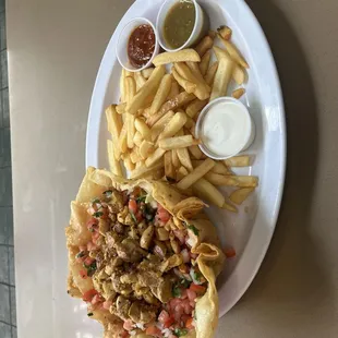 Tostada salad , we have al pastor, chicken or carne asada .