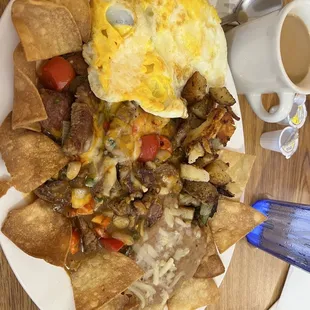 Steak Ranchero with refried beans and potatoes