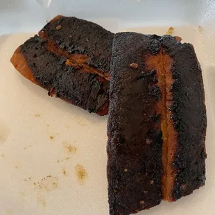 two pieces of meat on a plate