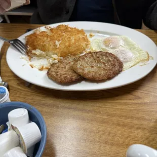 Two eggs, hash browns, homemade sausage patties.