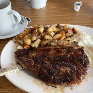 Bone in steak two eggs over medium and taters . Good selection of hot teas also