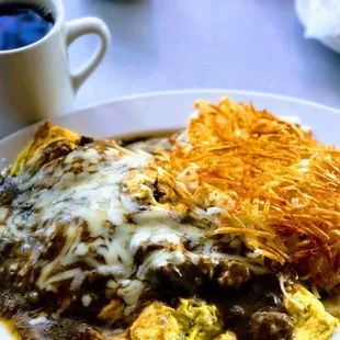 Chili verde omelet with hash browns.