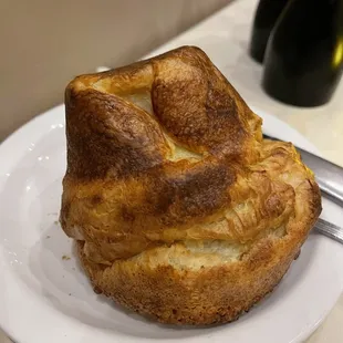 a pastry on a plate with a fork