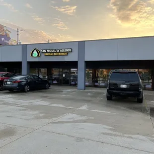a man walking in front of the restaurant