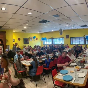 a large group of people eating