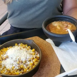 a woman holding a tray of food