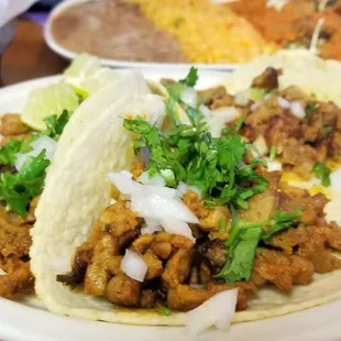 Al pastor tacos are my go to. The rice and beans are perfect as well. Worth the wait!