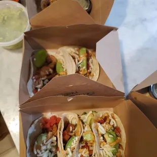 Veggie burrito (top), huge side of guac with (side pictured next to the chicken tacos) and chicken tacos