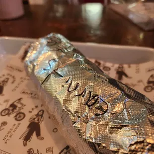 I love it when they wrap it up, and I pull the foil down to reveal the burrito for the first bite