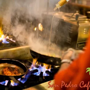 a person cooking food on the stove