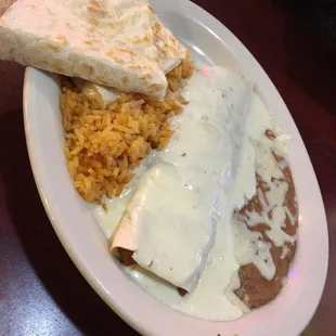 Lunch special number 7! Bean burrito, quesadilla, Mexican rice and beans with added queso sauce on top. 5 bucks!