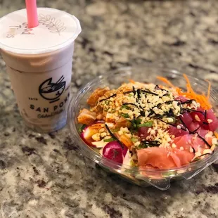 a bowl of food and a drink
